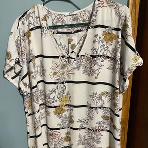 Maurice’s brand. White blouse with v-neck and accent.